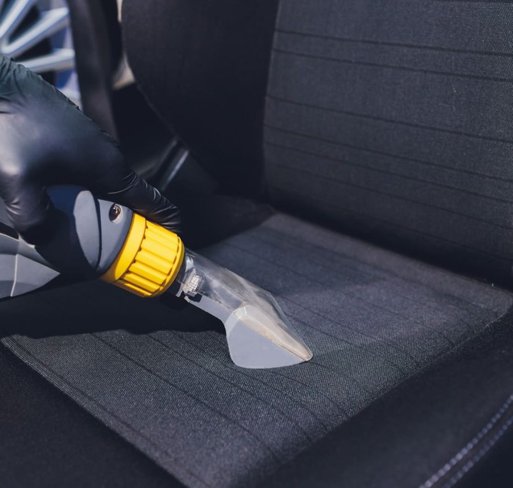 Car interior textile seats chemical cleaning with professionally extraction method. Early spring cleaning or regular clean up